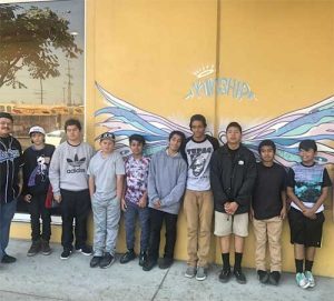 SBUSD Supported Program - Condor Cares Students in front of a condor mural