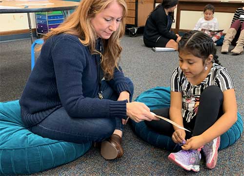 SBEF Signature Program - Readers are Leaders participants - adult and child reading together